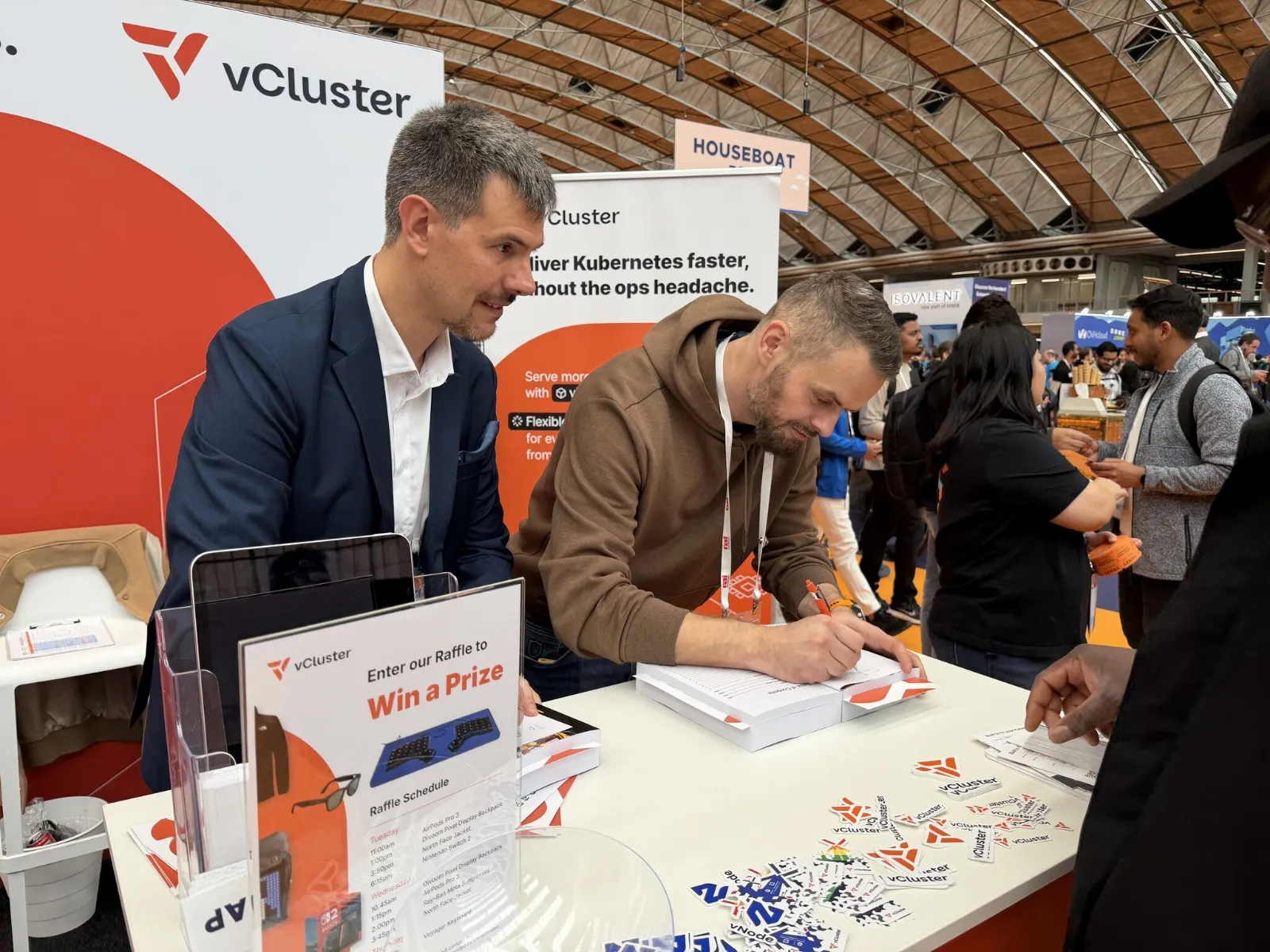 Greg signing copies of Kubernetes Recipes