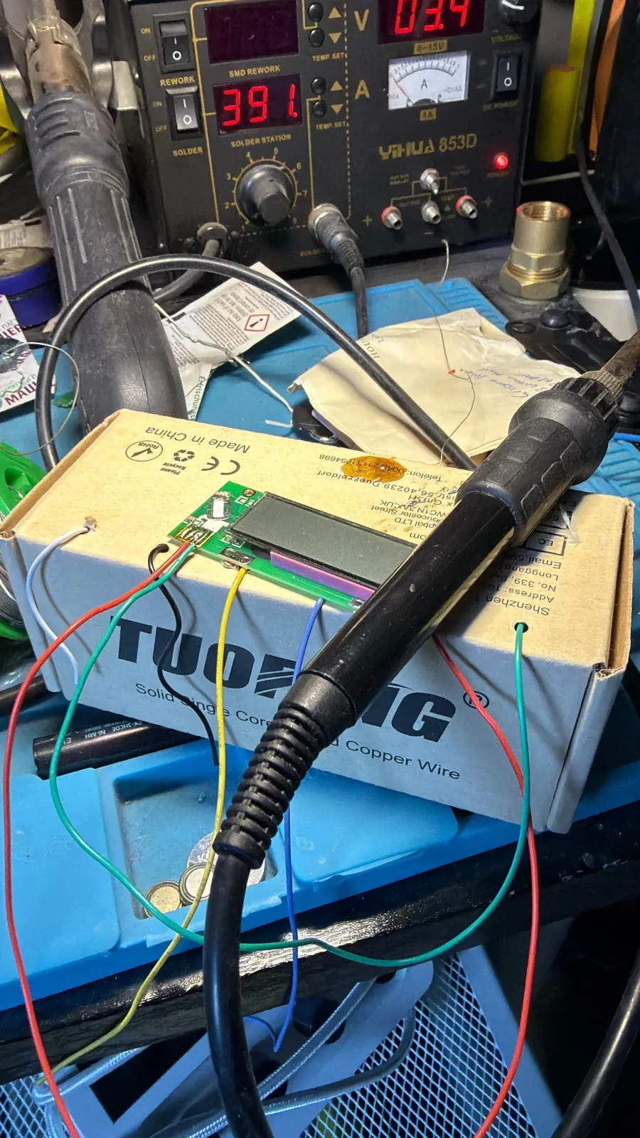 Electronics prototypes and a soldering station on Greg's bench