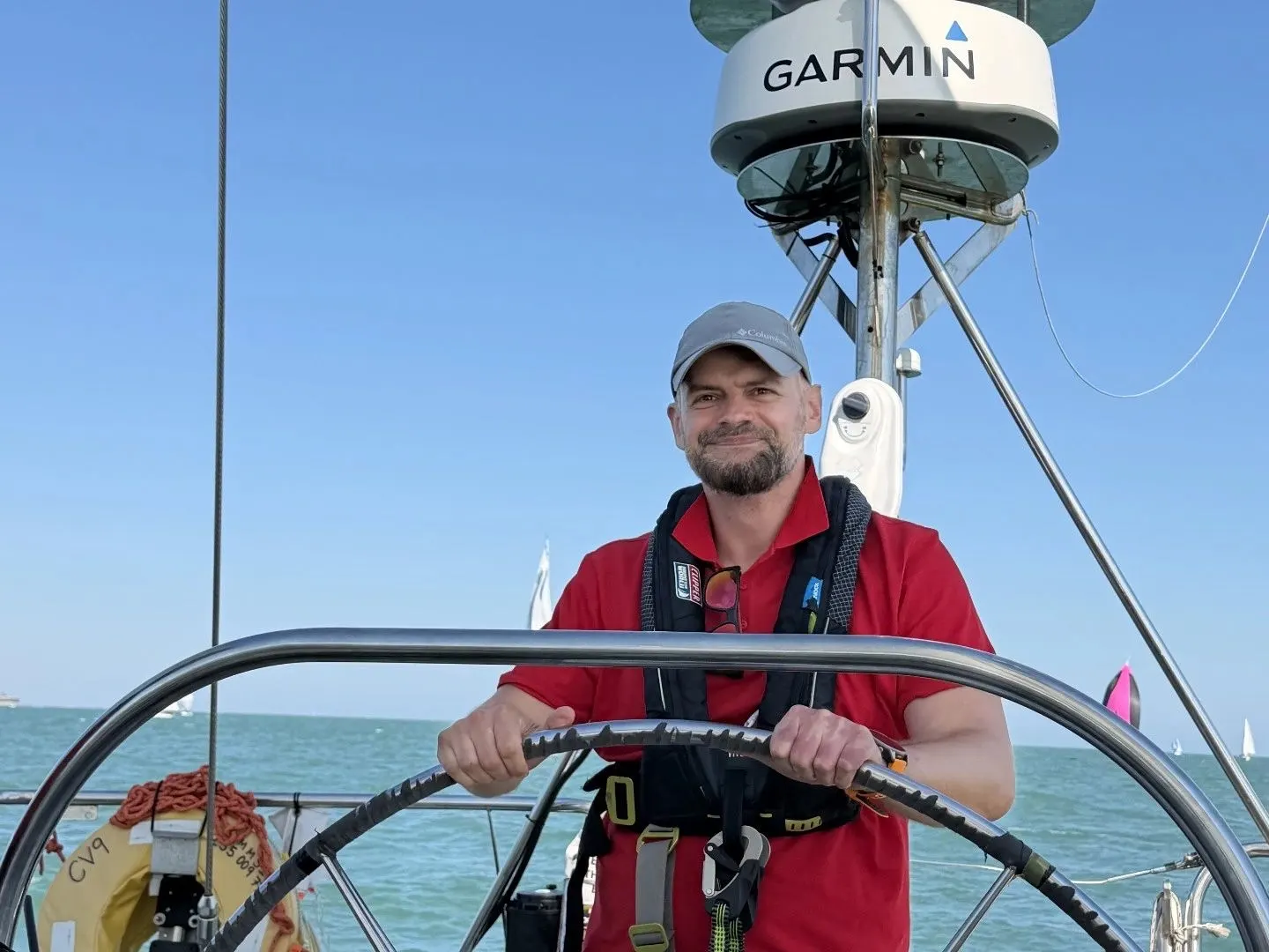 Greg at the helm of a Clipper 68